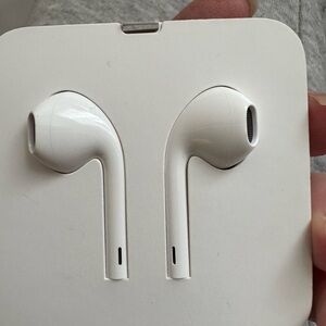 White Wired Apple Earbuds. Power cable. Never used and never opened!